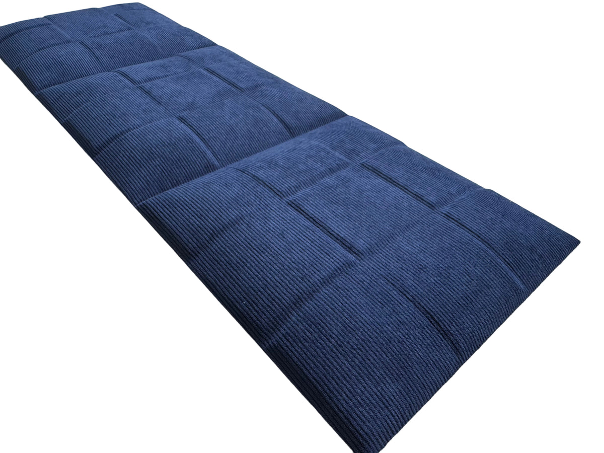 Britwall SoftPad self adhesive upholstered headboard wall panel in Midnight Navy, pack of 4, installed above bed