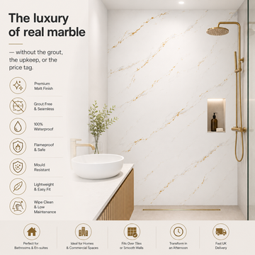 Modern bathroom with carrara marble-like wall finish, sink, and shower setup.